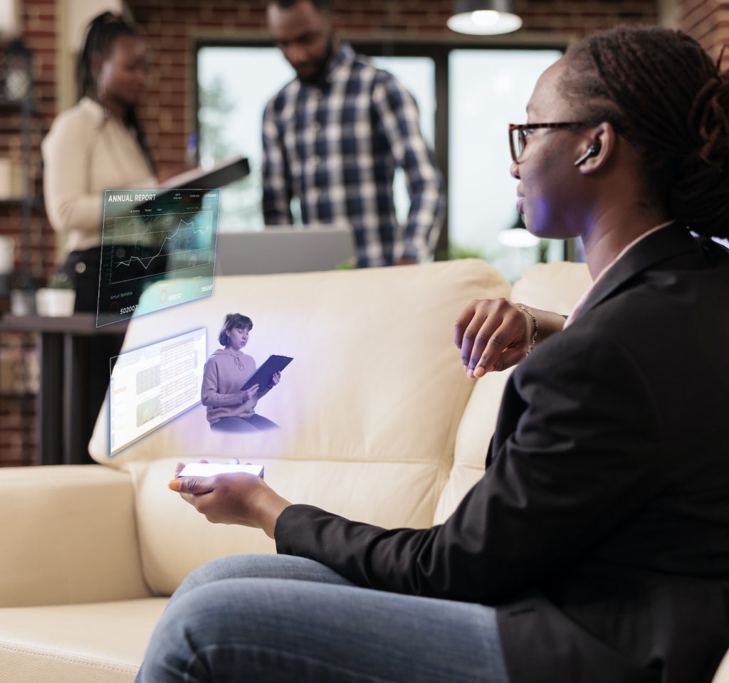 female-employee-talking-to-ai-hologram.jpg